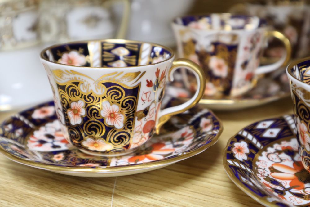 A set of six Royal Crown Derby miniature tea cups and saucers, date codes 1920s and a Noritake fifteen piece coffee service